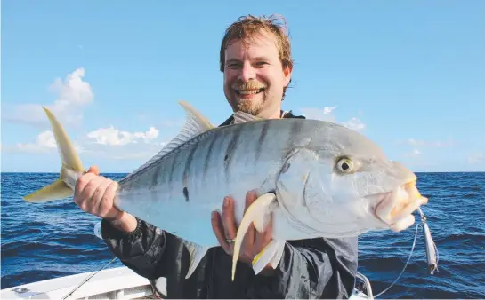  ??  ?? WORTH THE EFFORT: Local vet Richard Amos had his work cut out landing this metal- jig- eating golden trevally.