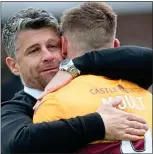  ??  ?? RELIEF: Stephen Robinson hugs hero Moult