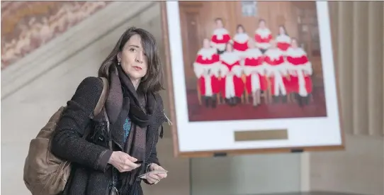  ?? ADRIAN WYLD/THE CANADIAN PRESS ?? École Polytechni­que shooting survivor Nathalie Provost leaves the Supreme Court of Canada on Friday following a decision on Quebec’s gun-control data.