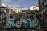  ?? DIEGO IBARRA SANCHEZ — THE NEW YORK TIMES ?? Hezbollah leader Hassan Nasrallah is depicted second from left in a mural in Beirut on Aug. 13, 2020.