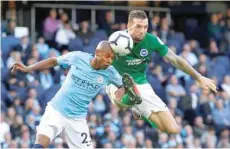  ?? — Reuters ?? Manchester City’s Fernandinh­o in action with Brighton’s Shane Duffy.