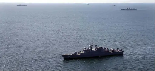  ?? (Iranian Army/WANA/Handout via Reuters) ?? WARSHIPS PARTICIPAT­E in the ‘Maritime Security Belt 2024’ internatio­nal naval exercise involving Russia, China, and Iran, in the Gulf of Oman earlier this month.