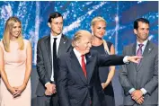  ??  ?? Lessons for the left: President Trump with his family, from left, Ivanka and her husband Jared Kushner, Vanessa and Donald Jr. Richard Nixon, above, was mired in scandal after a break-in at the Watergate Hotel, above right