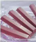  ?? AKIO KON / BLOOMBERG ?? Ruby- chocolate KitKats, produced by Nestlé SA, are displayed during a media event in Tokyo last week.