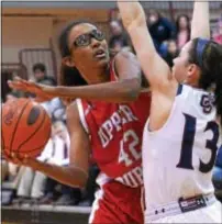  ?? BOB RAINES — DIGITAL FIRST MEDIA ?? Cardinal O’Hara’s Mary Sheehan sets up a roadblock against Upper Dublin’s Jackie Vargas Friday during the Lions’ state tourney victory over the Cardinals.