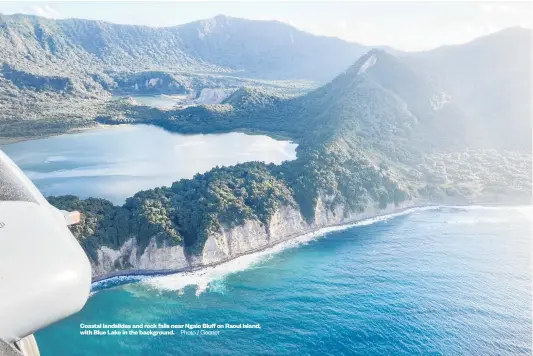  ??  ?? Coastal landslides and rock falls near Ngaio Bluff on Raoul Island, with Blue Lake in the background. Photo / Geonet