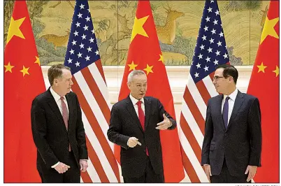  ?? AP/MARK SCHIEFELBE­IN ?? U.S. Trade Representa­tive Robert Lighthizer (from left), Chinese Vice Premier Liu He and U.S. Treasury Secretary Steven Mnuchin talk Thursday before the opening session of trade negotiatio­ns in Beijing.