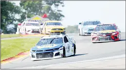  ??  ?? Chase Elliott leads the field through the area known as ‘The Bus Stop’ during a NASCAR Cup Series auto race at Watkins Glen Internatio­nal on Aug 4 in Watkins Glen, New York.
(AP)