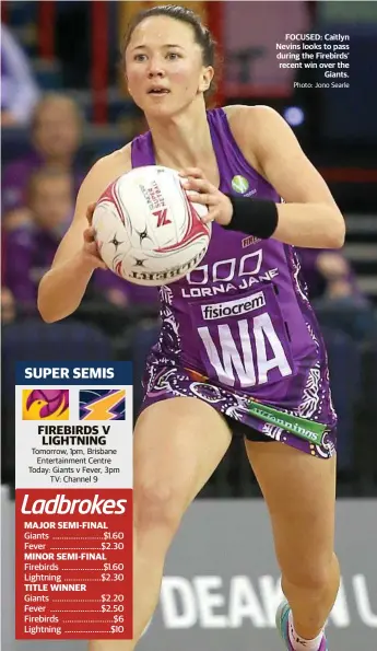  ?? Photo: Jono Searle ?? FOCUSED: Caitlyn Nevins looks to pass during the Firebirds’ recent win over the Giants.