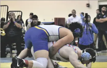  ?? ODETT OCHOA PHOTO ?? Brawley Union Wildcat Robert Platt (center, top) competes against Granite Hills’ Keagen Kroeger in 198-pound weight division championsh­ip match during 59th Annual Holtville Rotary Invitation­al boys wrestling tournament on Saturday, January 28, at the John Kirchenbau­er Sports Complex in Holtville.