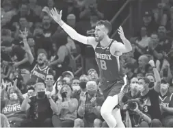  ?? ROB SCHUMACHER/THE REPUBLIC ?? Suns forward Frank Kaminsky reacts after making a 3-pointer against the Trail Blazers at Footprint Center on Wednesday night in Phoenix.