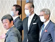  ??  ?? Foreign Minister S Jaishankar (right) follows his Japanese counterpar­t Toshimitsu Motegi on his arrival for their luncheon meeting in Tokyo on Wednesday