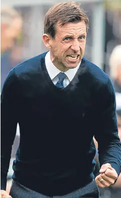  ??  ?? Neil McCann shows his emotions as Dundee extend their unbeaten run under his charge to three games.