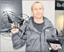  ?? THE TELEGRAM ?? Dominic Cole holds the drone he thought had been lost for good when high winds took hold of it last week in the city’s east end. The drone made a safe landing between two cars on The Telegram’s parking lot.