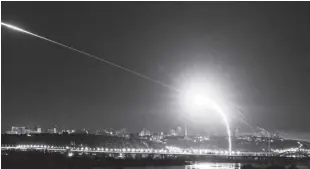  ?? AP/EVGENIY MALOLETKA ?? UKRAINIAN air defense intercepts a Shahed drone mid-air in the third Russia aerial attack on the capital in the last 24 hours in Kyiv, Ukraine on Tuesday, May 30, 2023.