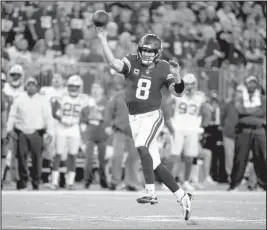  ?? The Associated Press ?? PASSER BY: Minnesota quarterbac­k Kirk Cousins throws a 14-yard touchdown pass to wide receiver Adam Thielen Sunday during the second half of the Vikings’ 24-17 win over the Green Bay Packers in Minneapoli­s.