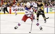  ?? Emilee Chinn / Getty Images ?? The Rangers’ Mika Zibanejad controls the puck against the Penguins during Game 4 of their first-round Stanley Cup playoff series on Monday.