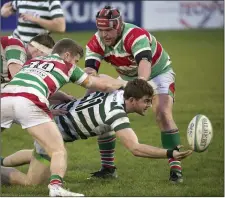  ??  ?? Paudie Geoghegan feeds the ball back to his colleagues.