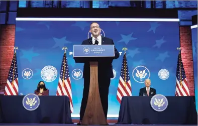  ?? Carolyn Kaster / Associated Press ?? Miguel Cardona, President-elect Joe Biden's nominee for Secretary of Education, speaks after being introduced at The Queen Theater in Wilmington, Del., on Wednesday, as Biden, right, and Vice President-elect Kamala Harris, look on.