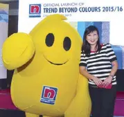  ??  ?? Nippon Paint’s Blobby with Serene Pang, representa­tive of the Color Marketing Group and the sales and marketing director for Internatio­nal Colour Manufactur­ing Corporatio­n, The Duha Group