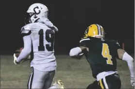  ?? PHOTO TOM BODUS ?? Calexico receiver Andrew Rivera (19) scores the Bulldogs’ first touchdown of the evening against Holtville High School in a CIF-SDS playoff matchup Friday evening in Holtville.