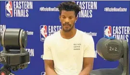 ?? Dan Woike Los Angeles Times ?? JIMMY BUTLER dons a T- shirt with the name of his business, Big Face Coffee, a venture that has ended up creating a bond among his Miami teammates.