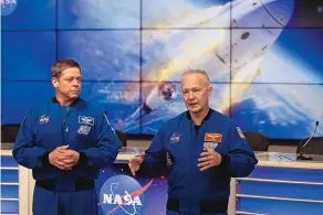  ?? JOHN RAOUX/ASSOCIATED PRESS ?? Astronauts Bob Behnken, left, and Doug Hurley speak during a news conference Sunday at the Kennedy Space Center in Cape Canaveral, Florida.