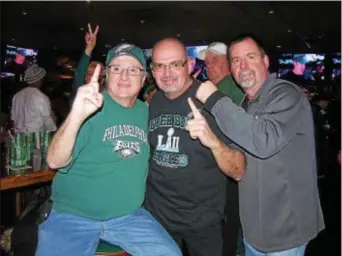  ?? KEVIN TUSTIN – DIGITAL FIRST MEDIA ?? Eagles fans, from left, John Reavy, Ed Carrigan and Rich Loane, root for their favorite underdogs during Sunday night’s Super Bowl at Miller’s Ale House in Springfiel­d.