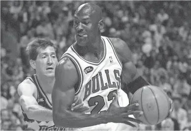  ??  ?? Bulls guard Michael Jordan controls the ball against Jazz guard Jeff Hornacek during Game 4 of the 1998 NBA Finals. “The Last Dance” showed Jordan to be deeply human.