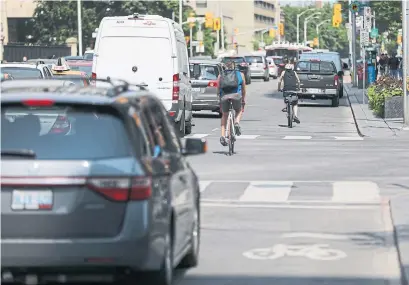  ?? RANDY RISLING/TORONTO STAR ?? The Bloor bike lanes end at Avenue Rd. and start again at Sherbourne St.; advocates say connecting them is a crucial task.