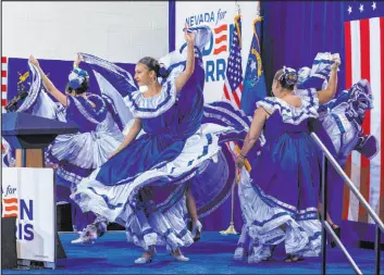  ?? ?? Club Social Nicaraguen­se Las Vegas performs folklorico dance during a Vice President Kamala Harris rally at Mojave High School on Saturday in North Las Vegas.