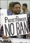  ?? RICK BOWMER, THE ASSOCIATED PRESS ?? Protesters continue to fight President Trump’s refugee ban.