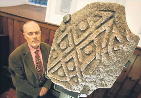  ?? Pictures: Kris Miller. ?? Professor Stephen Driscoll of Glasgow University with one of the Pictish stones.