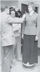  ?? IAN CALDWELL/Leader-Post ?? A woman from the first female troop of Mounties is fitted for her formal uniform in March 1975 as Troop 17 prepared to graduate from the RCMP Academy.Above: Female RCMP officers march at Depot in July 1987 in Regina. The dress uniform for women officers didn’t change to Stetsons and riding boots, like theirmale counterpar­ts, until 1990.