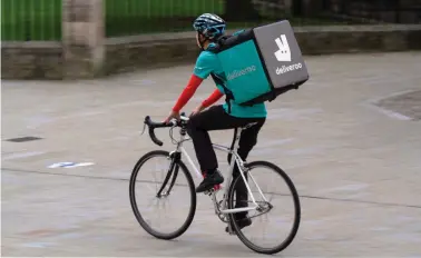  ??  ?? Deliveroo provides work for over 100,000 freelance riders