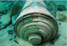  ??  ?? Left: One of the cannons from the Armada wreck is removed from the water at Streedagh, Co. Sligo. Above: a cannon on the seabed