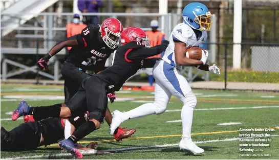  ?? ALLEN CUNNINGHAM/SUN-TIMES ?? Simeon’s Andre Crews breaks through the Kenwood defense to score a touchdown Saturday.