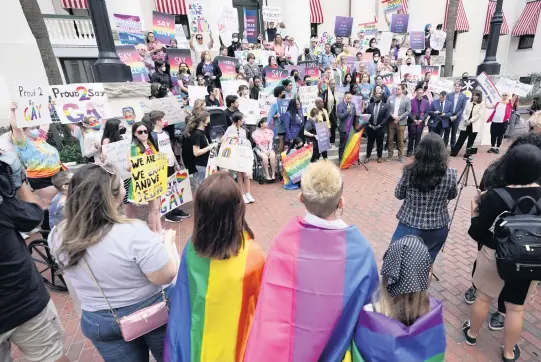  ?? WILFREDO LEE AP ?? Demonstrat­ors gather on the steps of the Florida Historic Capitol Museum in front of the Florida State Capitol on March 7 in Tallahasse­e to protest the Legislatur­e’s ‘Don’t Say Gay’ bill.