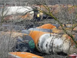  ?? GENE J. PUSKAR — THE ASSOCIATED PRESS ?? The cleanup of portions of a Norfolk Southern freight train that derailed Friday night in East Palestine, Ohio, continues on Thursday, Feb. 9, 2023.