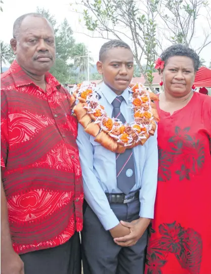  ?? Photo: Simione Haravanua ?? Vilomena Niulele flanked by her parents father Aborosio Keretabua (left), and mother Teresia Keretabua after the National Fire Authority passing-out parade at the naval base in Togalevu, outside Lami, on August 22, 2019.