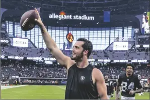  ?? L.E. BASKOW/LAS VEGAS REVIEW-JOURNAL ?? Raiders quarterbac­k Derek Carr (4) celebrates with the fans after defeating the Denver Broncos on Oct. 2, 2022, in Las Vegas.