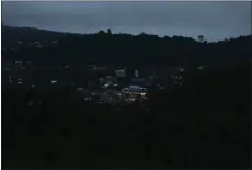  ?? Guy Mccarthy / Union Democrat ?? Lights from downtown Sonora are visible from near the top of Dragoon Gulch trail at 7:10 a.m. Saturday, Dec. 7.