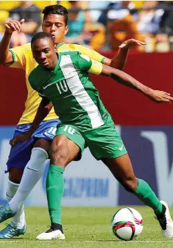  ??  ?? Kelechi Nwakali (10) of Nigeria is challenged by an opponent during the 2013 FIFA U-17 World Cup. Nwakali scored Nigeria’s opening goal against Atletico Madrid yesterday in Uyo