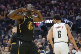  ?? JEFF CHIU — THE ASSOCIATED PRESS ?? Golden State Warriors forward Draymond Green celebrates after scoring against the Denver Nuggets during the second half of Game 1of an NBA basketball first-round playoff series in San Francisco, Saturday.