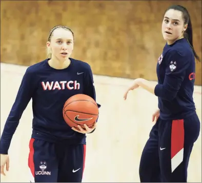  ?? David Butler II / USA TODAY ?? UConn’s Paige Buckers, left, and Nika Muhl are two of several freshmen who will make their postseason debuts on Saturday against St. John’s.