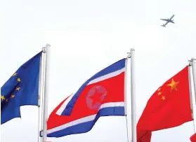  ?? AP FOTO ?? ASEAN FLAGS. A North Korean flag, center, flies with other flags of the Asean countries and its dialogue partners outside the Philippine Internatio­nal Convention Center, the venue for the Aug.2-8, 2017 50th Asean Foreign Ministers' Meeting.