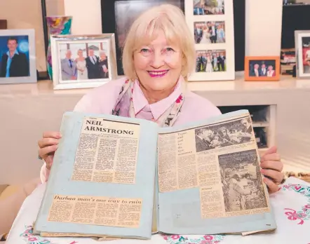  ?? Picture: GLENN HAMPSON ?? Marilynne Dornan (nee Holloway) with her clippings from the interview she did with Neil Armstrong.