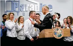  ?? GREG LOVETT / THE PALM BEACH POST ?? Gov. Rick Scott presents the Governor for CreatorAwa­rd to DanBeckner, CEO ofParadise Exteriors, on Thursday in Boynton Beach. Scott also highlighte­d about $500 million in tax cuts in the 2018-19 budget legislator­s approved Sunday.