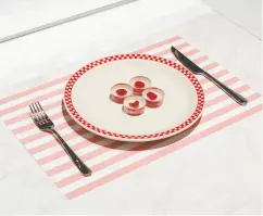  ??  ?? The finished product: Ouroboros steaks are plated in a display at the Philadelph­ia Museum of Art.