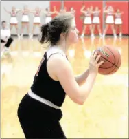  ?? Staff photograph by Mark Humphrey ?? Pea Ridge senior Maria Socha eyes a 3-pointer. Socha scored 12 points in the Lady Blackhawks’ 71-64 loss to Farmington on Tuesday, Dec. 18 in Cardinal Arena.